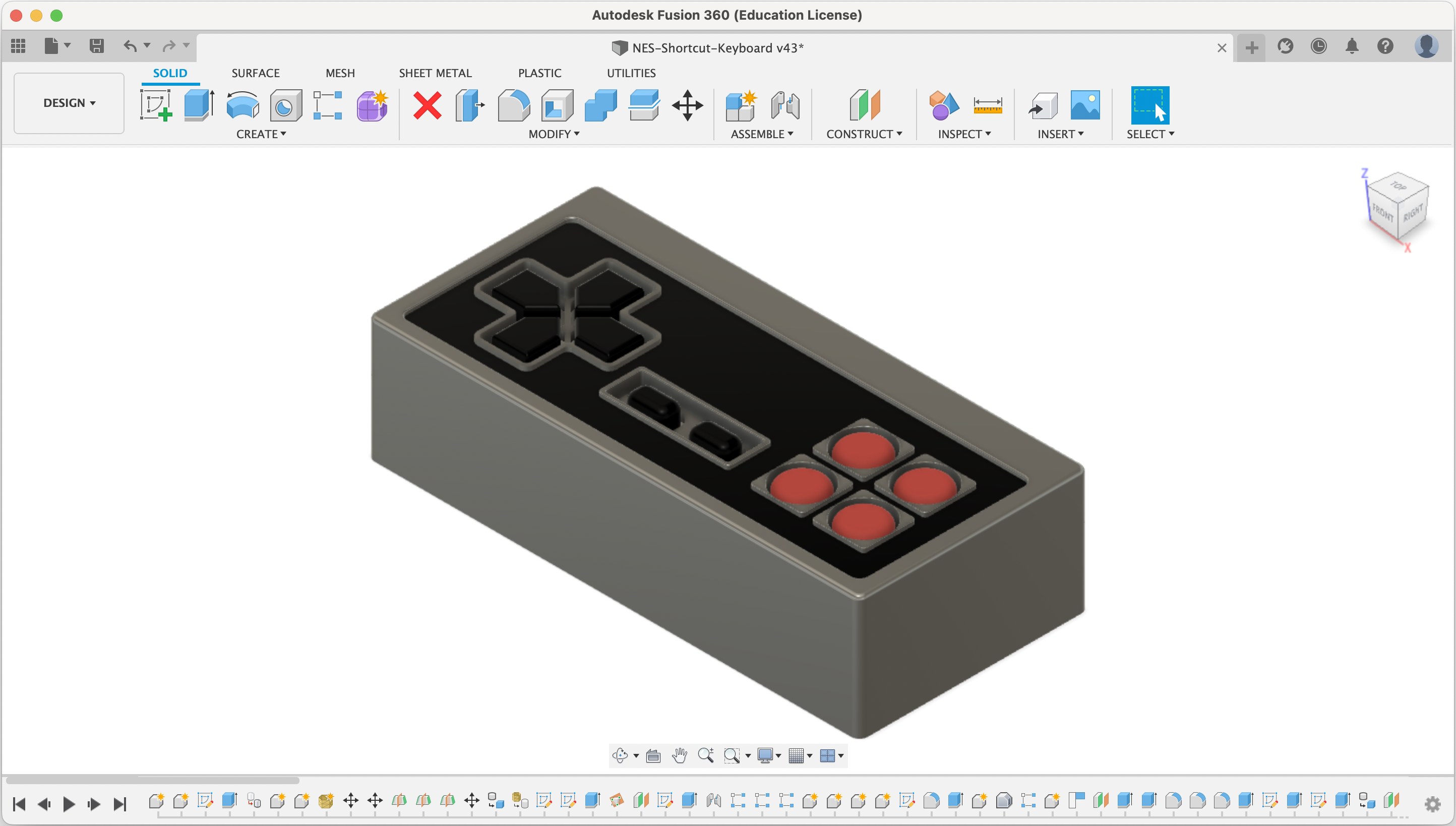 3d model of the controller containing all of the keys and the Adafruit Feather. There are 10 keys arranged to look like an NES controller, which has a gray case with a black top face.